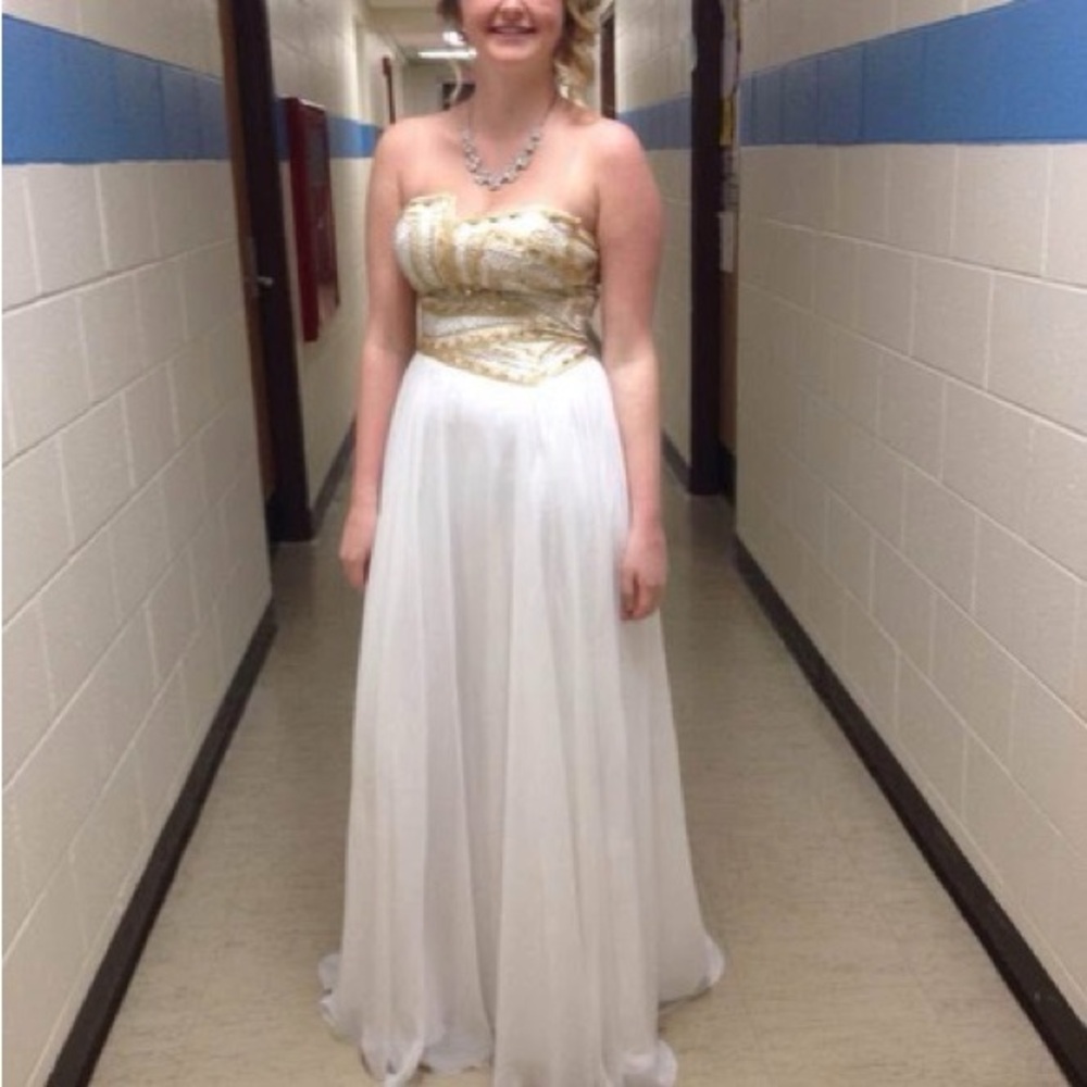 Elegant Gold and White Strapless Gown with corset tied back.